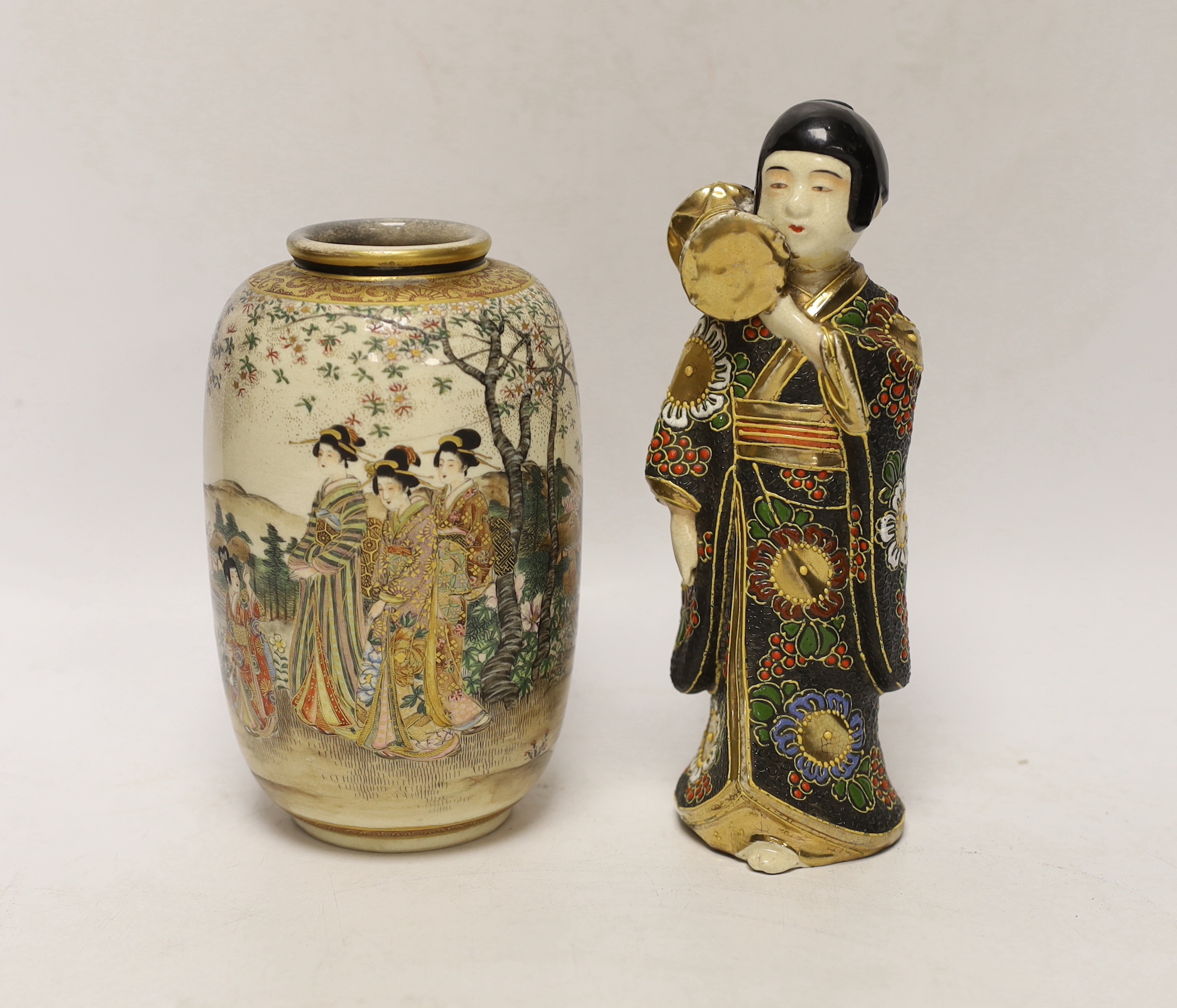 A Japanese Satsuma vase decorated with females wearing kimonos before a landscape and a figure